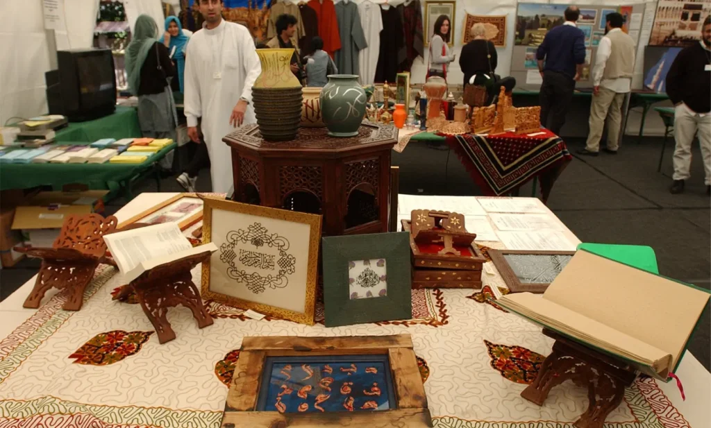 A table of books, leaflets and decorative objects at an exhibition