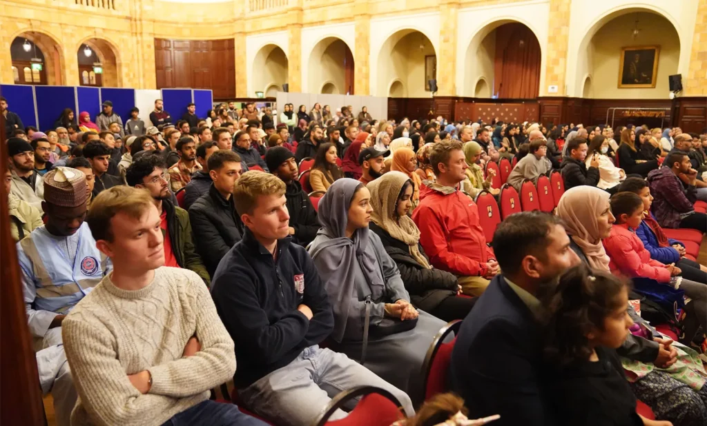 A packed audience listening at an Exhibition Islam talk